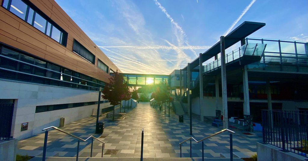 Morning sunrise shining on the Oberursel Campus boulevard